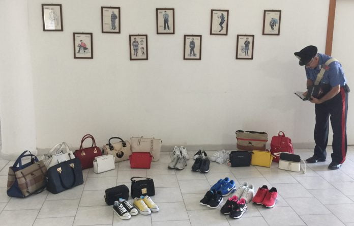 Scarpe e borse sequestrate devolute alla Caritas