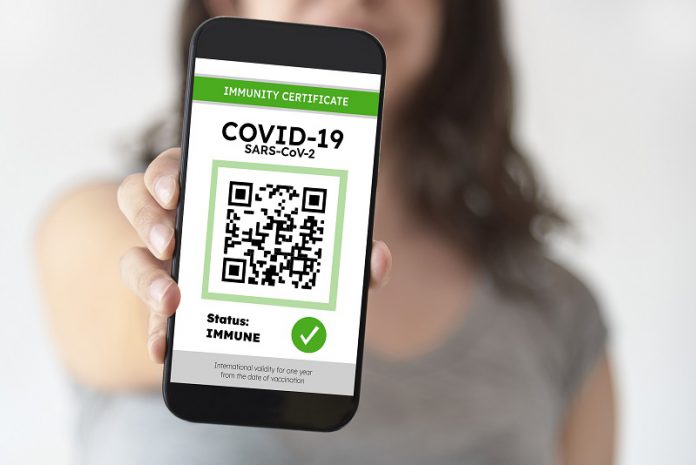 Unrecognizable woman showing on her smartphone a certificate of